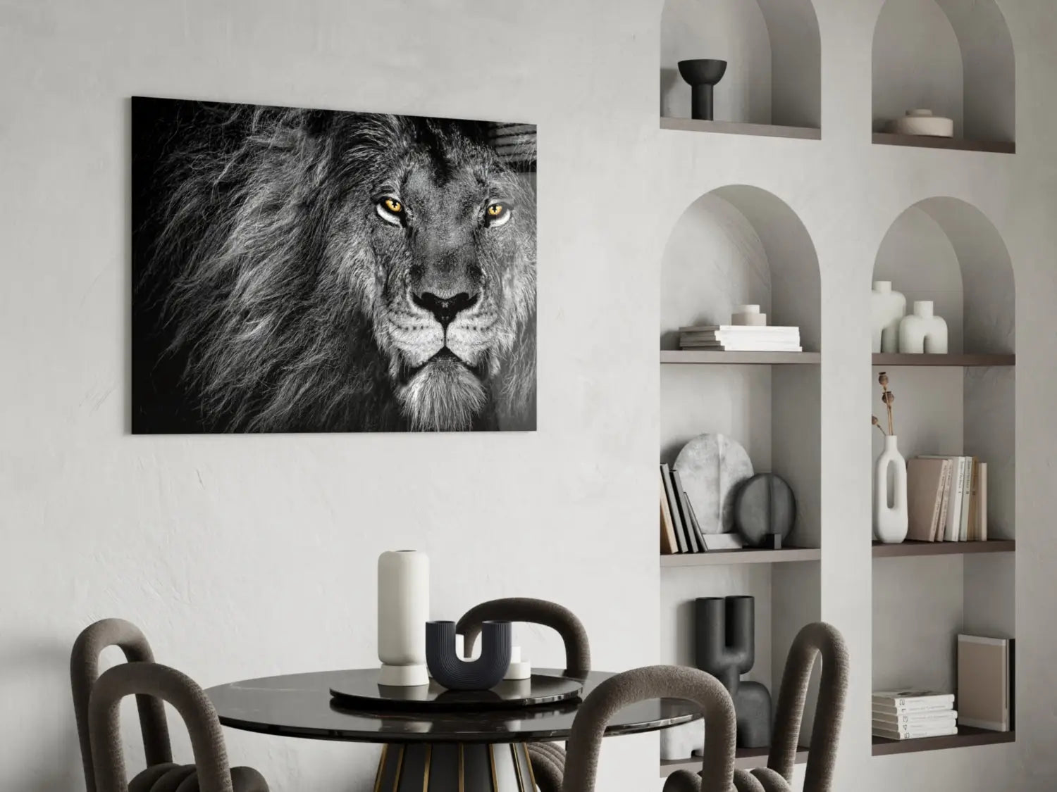 This piece is a black-and-white lion face on tempered glass wall art with striking yellow eyes mounted on a wall