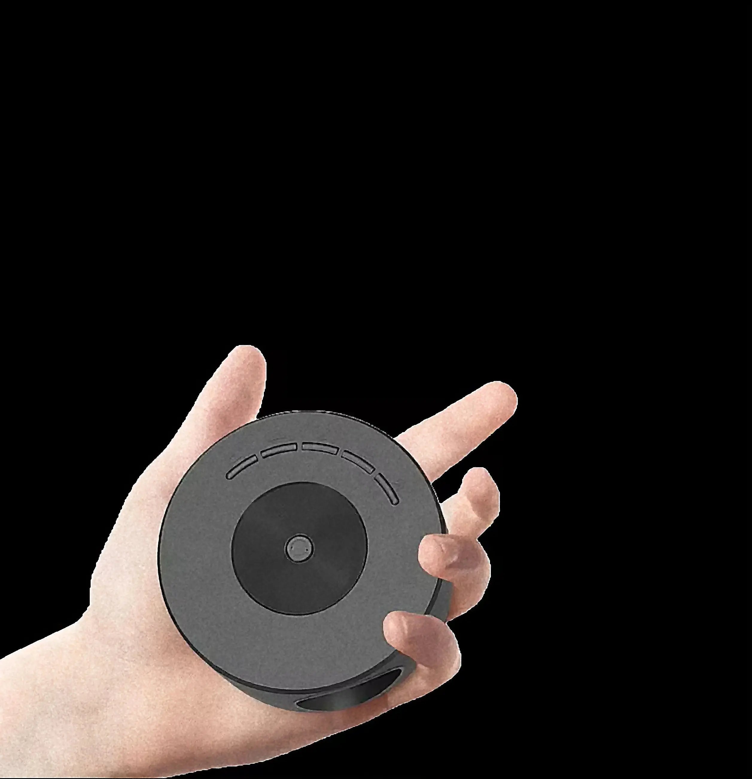 Black circular wireless charging pad with matte finish and concentric rings for vu-tek mini proiector